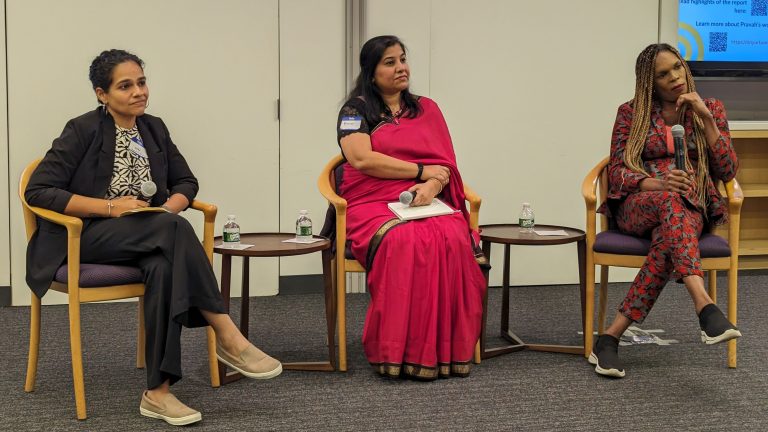 Neha Mankani, Ritikaa Khunnah, and Beyonce Karungi sit in a row facing the audience, holding microphones.
